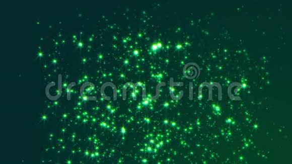 深绿色背景缓慢飞行的发光粒子视频的预览图