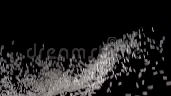 白米在黑色的背景上飞起来慢动作录像食物录像白米饭视频的预览图