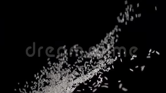 白米在黑色的背景上飞起来慢动作录像食物录像白米饭视频的预览图