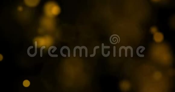 抽象的圆形金色闪光在黑色上流动视频的预览图