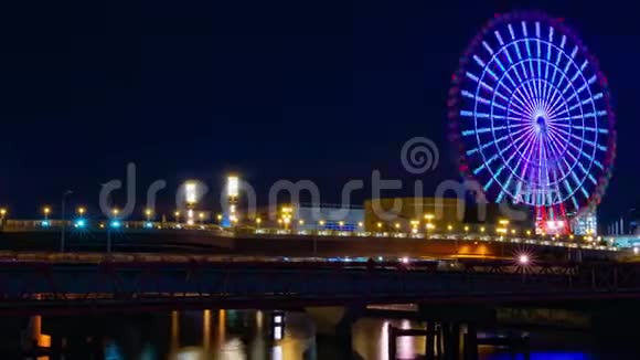 夜河附近的摩天轮在东京小田坝的时间流逝视频的预览图