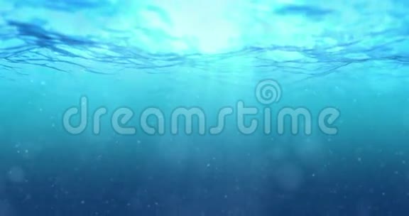 高质量的完美无缝深蓝海浪从水下背景与微粒子流动视频的预览图