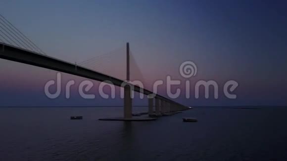 4k空中无人机海景令人惊叹的温暖的傍晚日落横跨平静的蓝海高速公路钢桥视频的预览图