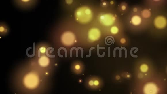 无缝环抽象发光球体黄金和黄色粒子从天空下降在黑色背景后退和效果视频的预览图