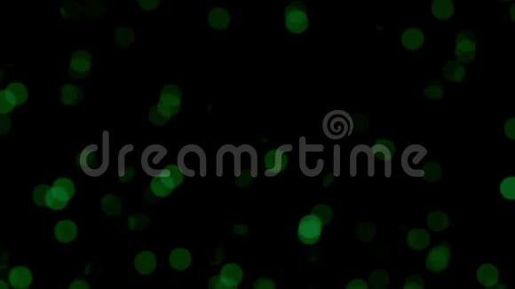 抽象的绿色粒子模糊地漂浮起来视频的预览图
