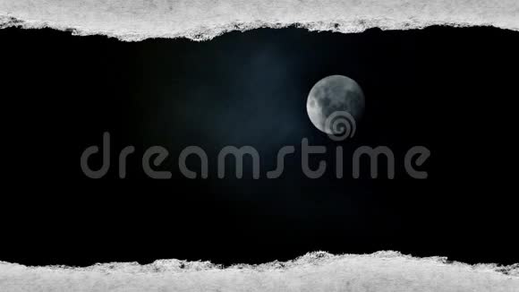 创意时间拍了一段视频一个发光的满月在夜空这是可见的通过一个纸洞视频的预览图
