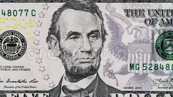创意4k视频五美元钞票移动细节与亚伯拉罕林肯特写肖像视频的预览图