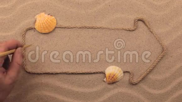 用手写在沙子上的字体用绳子做成的指针视频的预览图