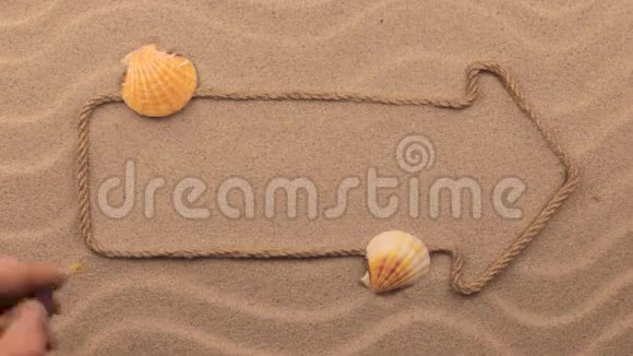 梦的题词用手写在沙滩上用绳子做成的指针视频的预览图