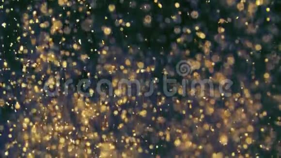 模糊离焦的抽象金色粒子移动混乱雪花视频的预览图