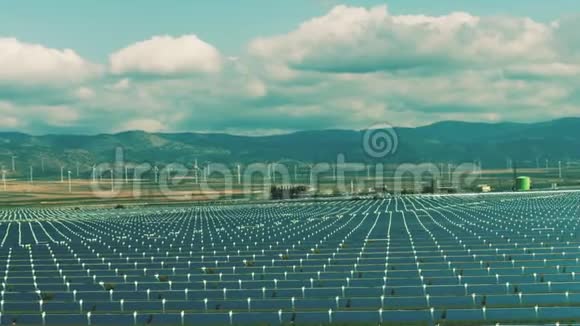 太阳能发电厂和风力发电机的鸟瞰图清洁可再生能源生产视频的预览图