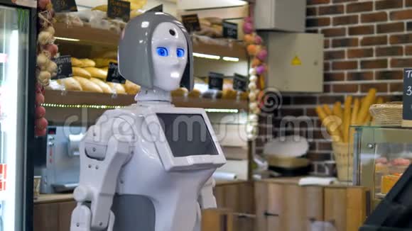 一个白色机器人在面包店柜台工作视频的预览图