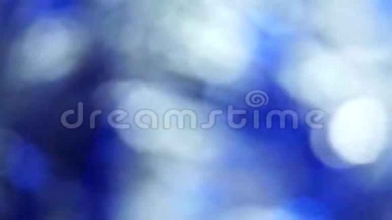 蓝色抽象模糊灯光旋转背景视频的预览图