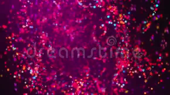 许多旋转的彩色粒子与波克计算机生成的三维彩色纸屑背景渲染视频的预览图