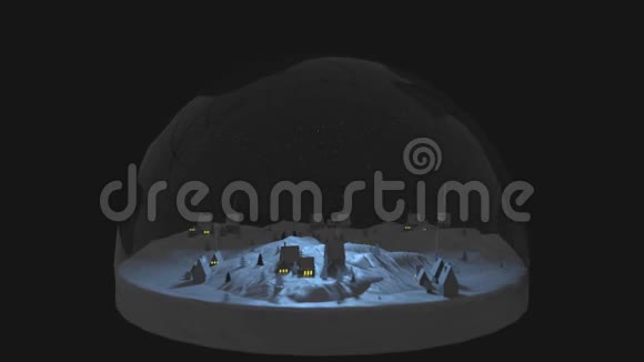 冰雪世界玻璃球里面有一个神奇的乡村村庄雪花雪和烟雾从房子的烟囱视频的预览图