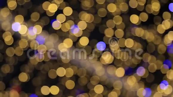 离焦的bokeh发光背景抽象的闪亮的金色灯光视频的预览图