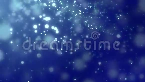 白色发光粒子落在深蓝色背景上视频的预览图