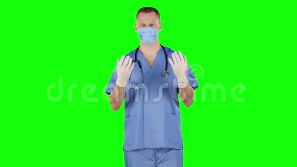 人脱下戴上手术手套绿色屏幕视频的预览图
