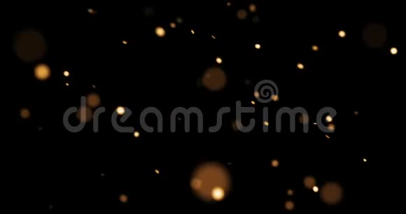 摘要金色辉光粒子对黑色背景的影响节日快乐新年活动视频的预览图