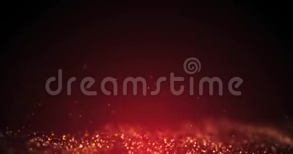 圣诞黄金颗粒背景循环无缝抽象颗粒黄金尘埃闪烁在红色背景视频的预览图