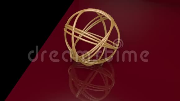 由金环组成的金球形结物体在黑色和暗红色背景上旋转几何镜像视频的预览图