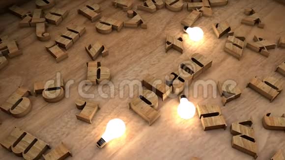 用灯泡在桌子上用木立方体木头字母文字串划出单词视频的预览图