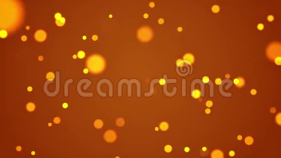 黄色圆圈闪亮的粒子动画无缝循环在黄金背景上视频的预览图