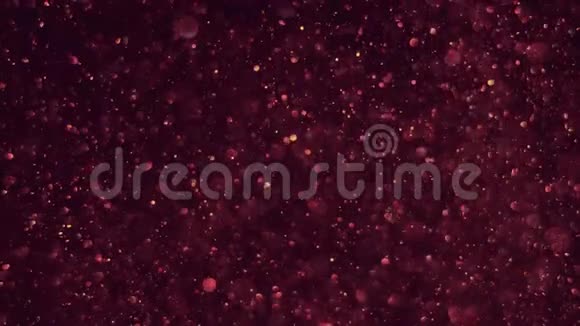 在暗红色的宇宙背景上光无缝透明的bokeh气泡在空气中平稳地升起闪闪发光视频的预览图