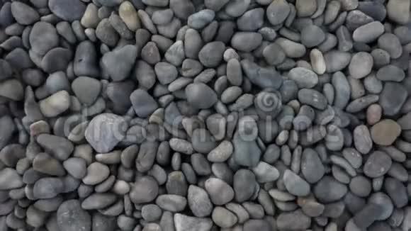 卵石滩海岸岩石图案纹理覆盖水效应视频的预览图