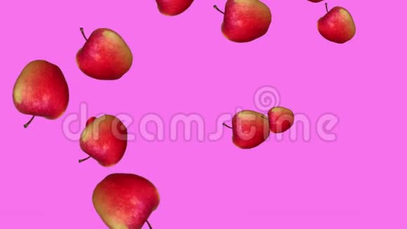 美丽的抽象彩色动画的红苹果下降和旋转的粉红色背景视频的预览图