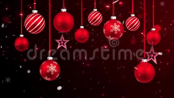 动画红色圣诞球红色火花和白色雪花在黑色背景视频的预览图
