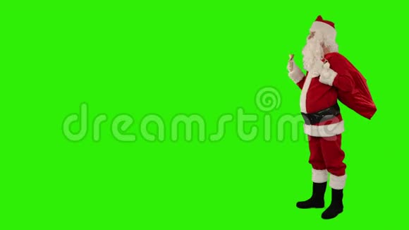 圣诞老人摇着一个有文字空间的钟绿色屏幕股票录像视频的预览图