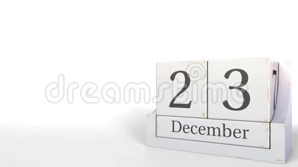 木立方体日历显示12月23日的日期3D动画视频的预览图