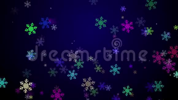 五颜六色的雪花飘落在深蓝色的背景上视频的预览图