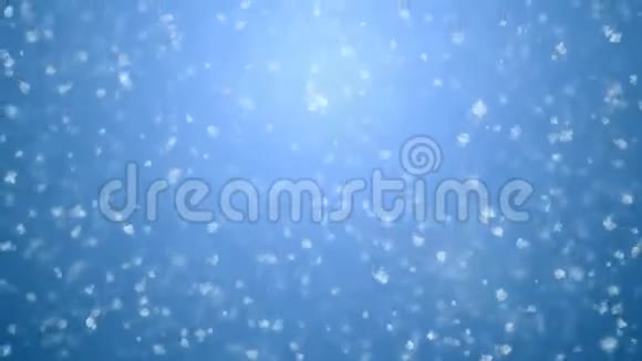 美丽温柔平静的降雪无缝在蓝色梯度3D动画随着dof模糊白色雪花飘落cg视频的预览图