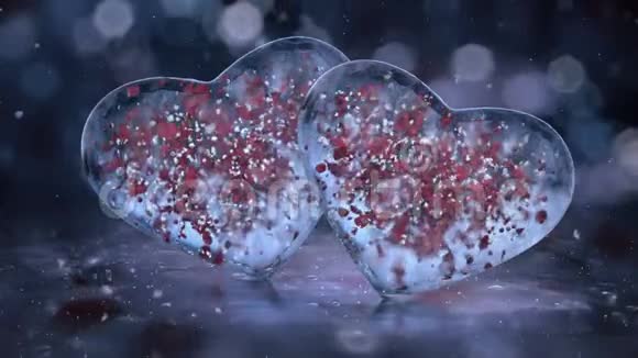 两颗蓝冰玻璃心与雪花红色花瓣运动背景回路视频的预览图