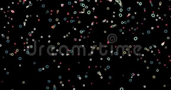 新年快乐庆祝活动落在黑色背景上的彩色雪花或糖果4k30秒视频的预览图