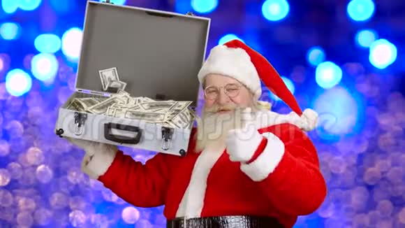 圣诞老人带钱的手提箱视频的预览图