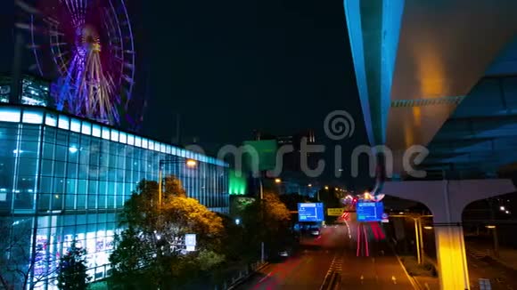 夜游游乐园附近的摩天轮东京时间流逝视频的预览图