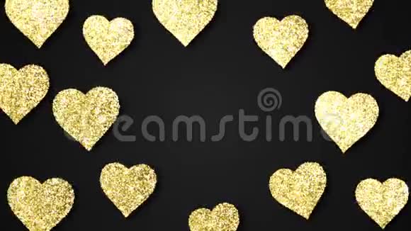 金色闪亮的心在黑色的背景上闪闪发光情人节节日抽象循环动画视频的预览图