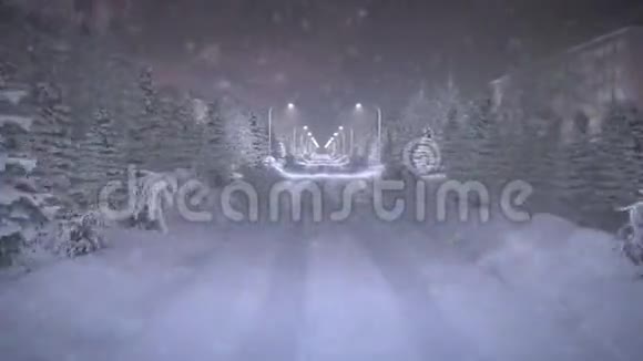 开在雪道上夜晚的城市下雪了视频的预览图