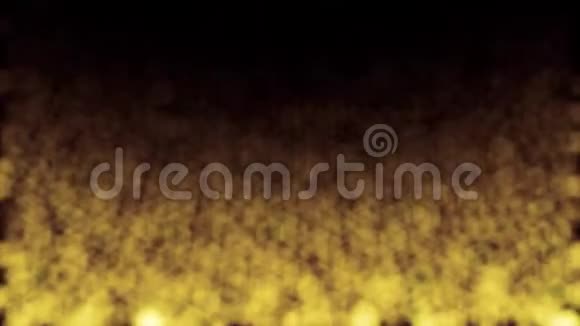 抽象的金色模糊的闪光尘埃从上到下流动在黑色运动的黄色模糊的小颗粒视频的预览图