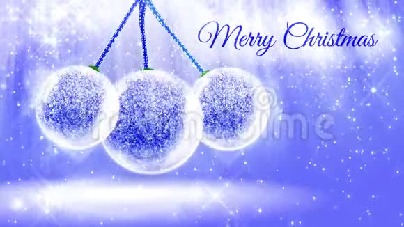 用闪闪发光的微粒和雪球或雪球中的火花组成圣诞快乐的明亮的光视频的预览图