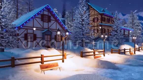 冬季夜晚下雪的高山山村视频的预览图