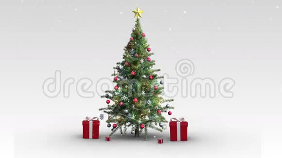 落在圣诞树上的雪和礼物视频的预览图