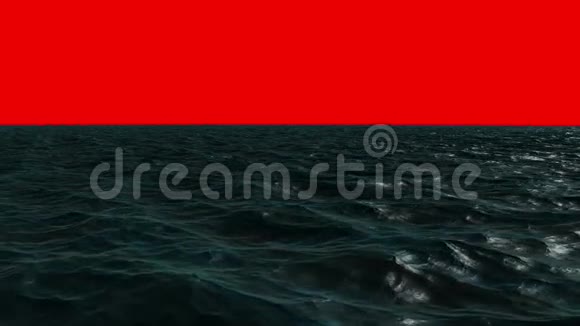 红幕天空下波涛汹涌的蓝色海洋视频的预览图