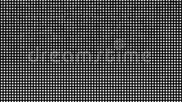 无缝半色调白点在黑色背景下出现并消失在运动中视频的预览图