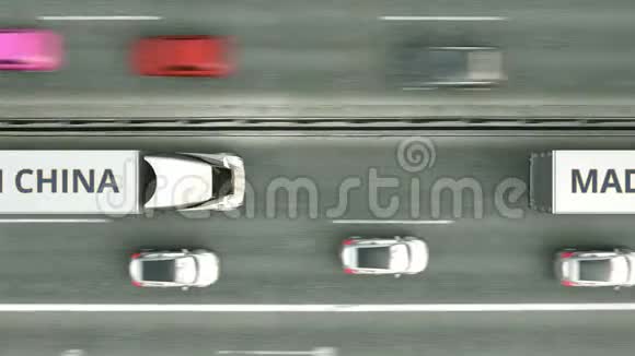 半挂车的高空俯视图中带MADE的中国文字沿公路行驶与中国有关的业务视频的预览图