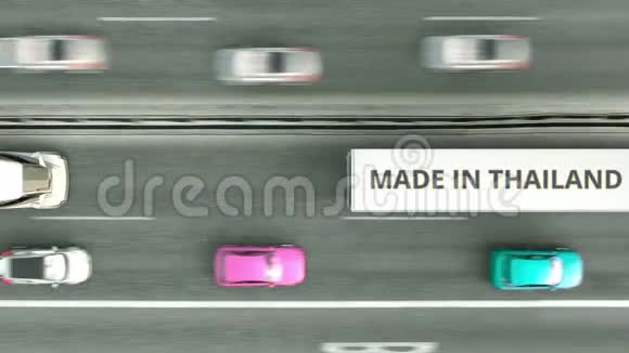 半挂车的高空俯视图带有MADE的泰国文字沿公路行驶泰国商业视频的预览图