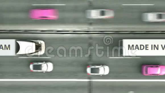 半挂车的高空俯视图带有MADE的VIETNAM文本沿高速公路行驶越南商业视频的预览图